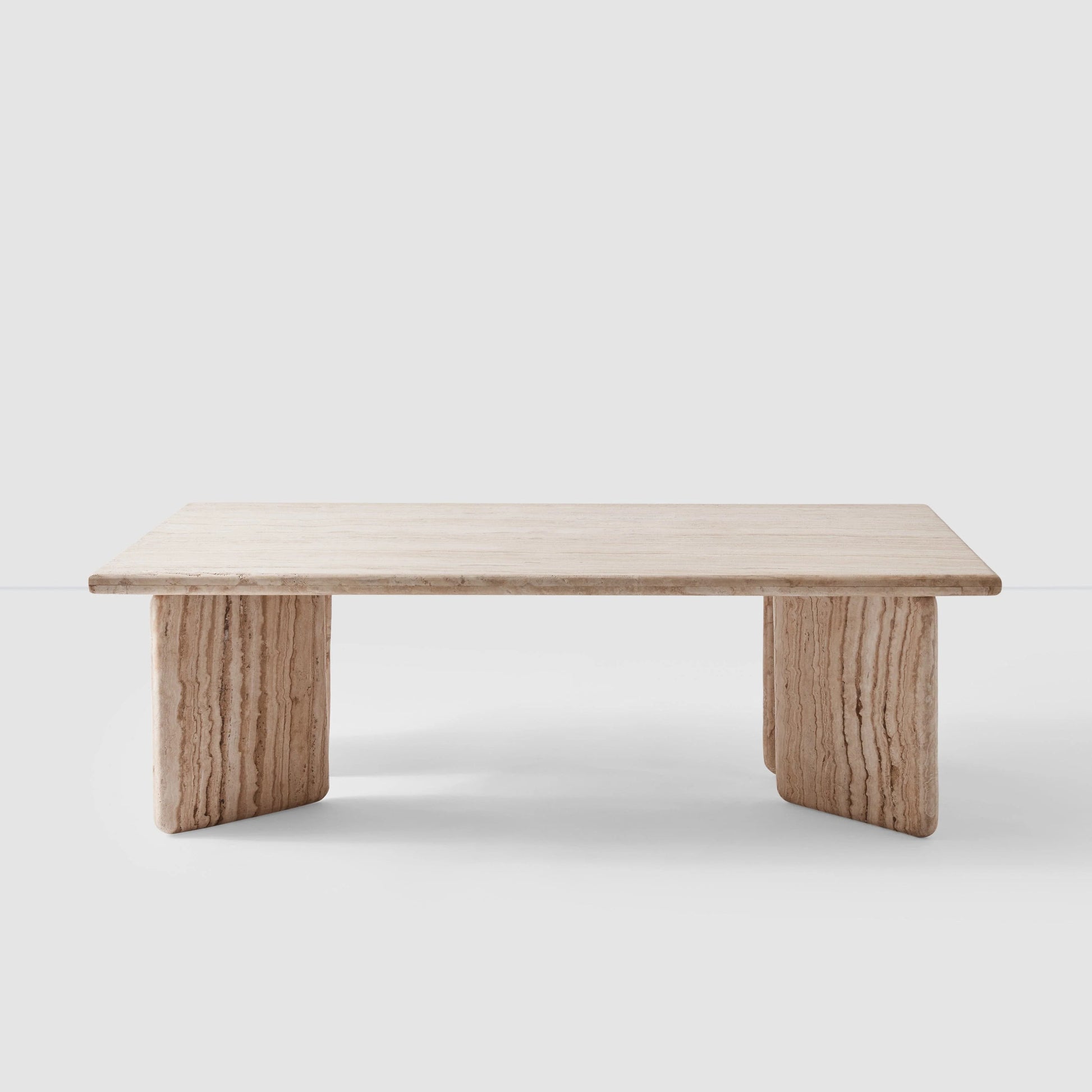 Blacklionmotorrow Amata Travertine Coffee Table in a modern living room setting